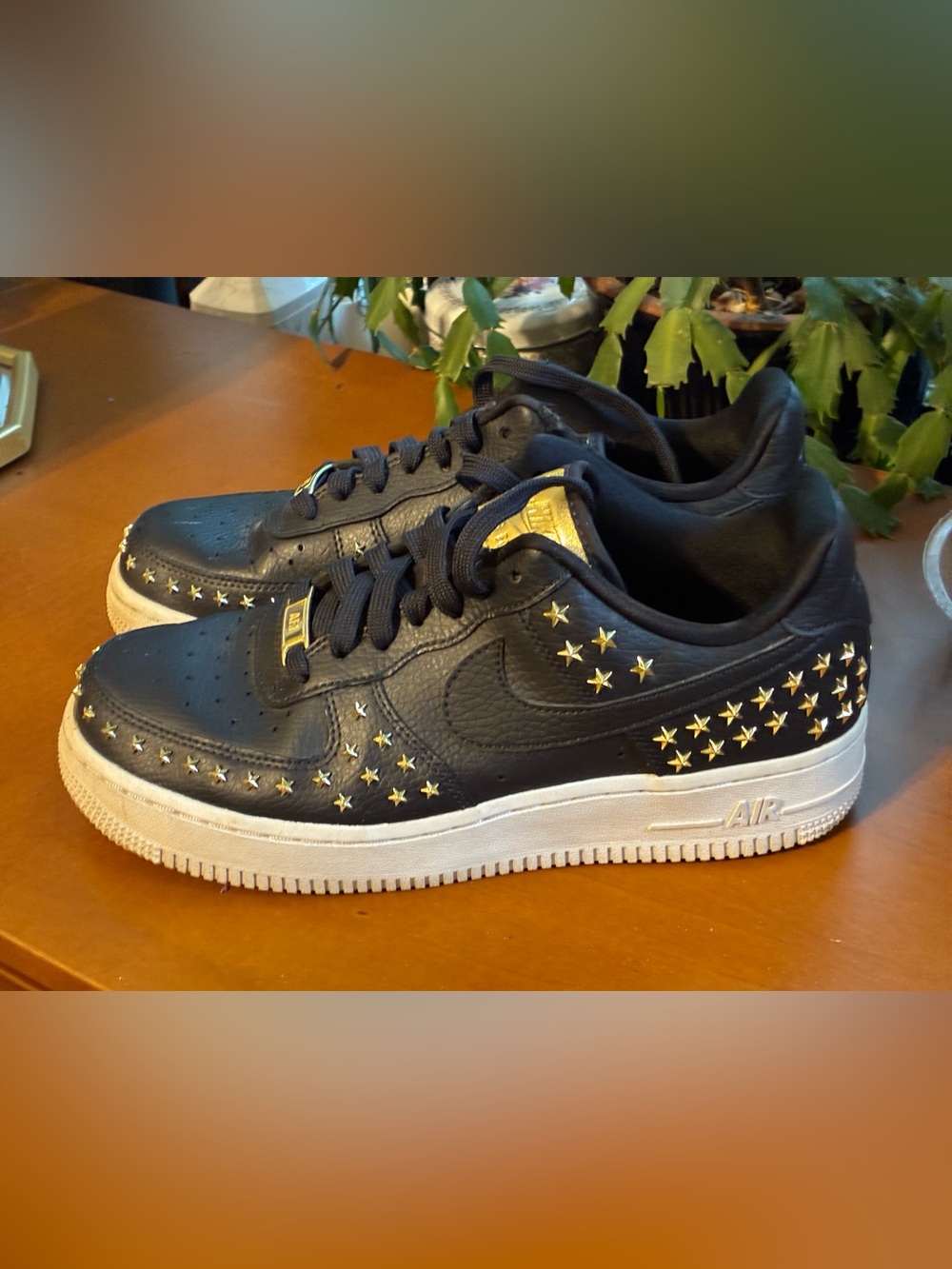 Nike Women’s Black Sneakers with Gold Star Accents